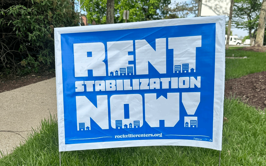 Picture of a yard sign that says "Rent Stabilization Now!" with a rockvillerenters.org URL.